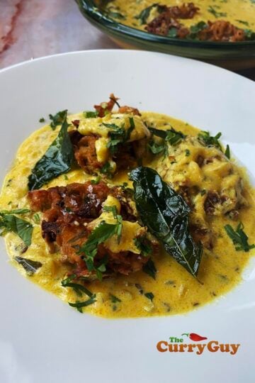 Plating the onion bhaji curry