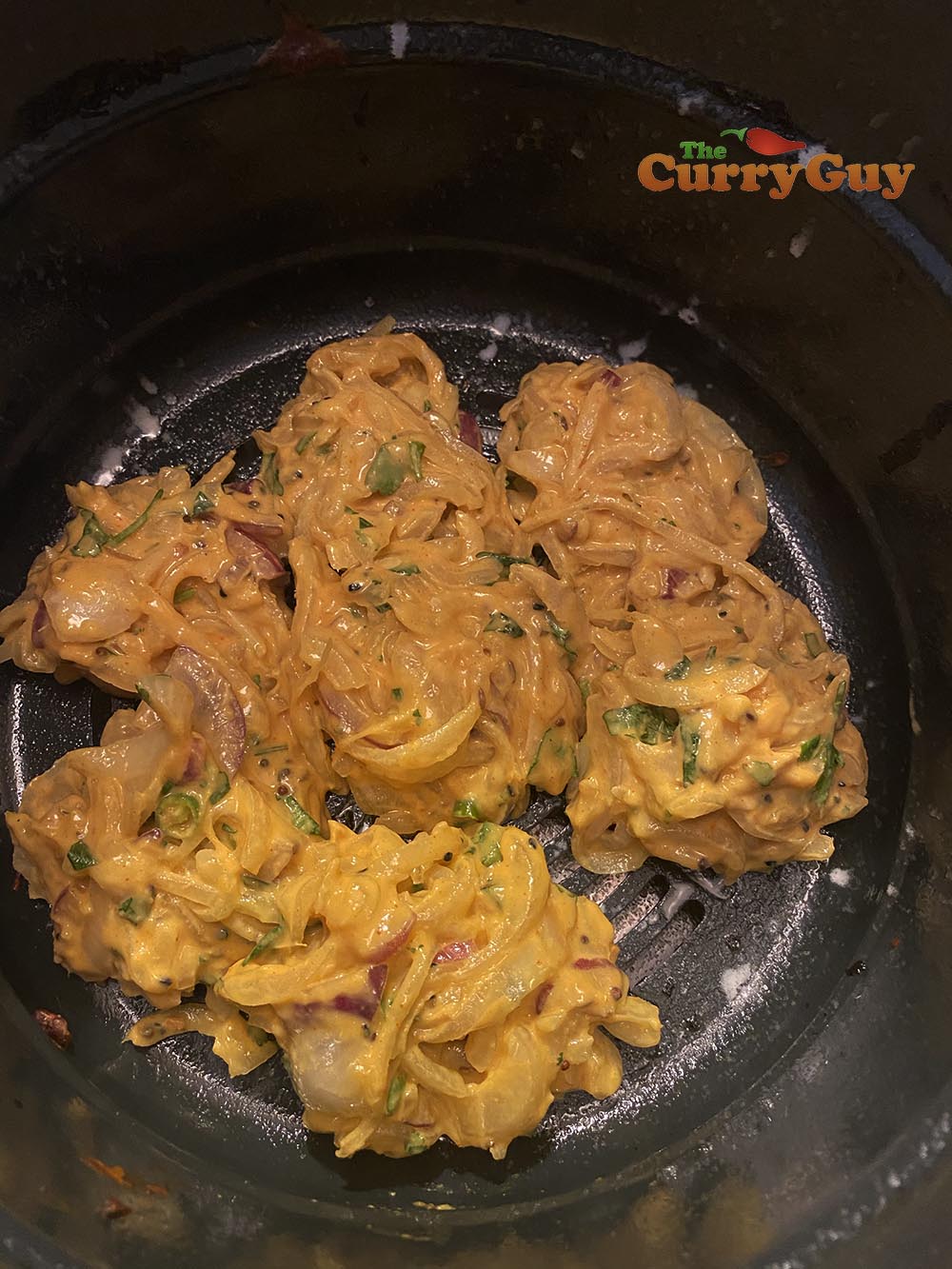 Place the onion bhajis in the air fryer