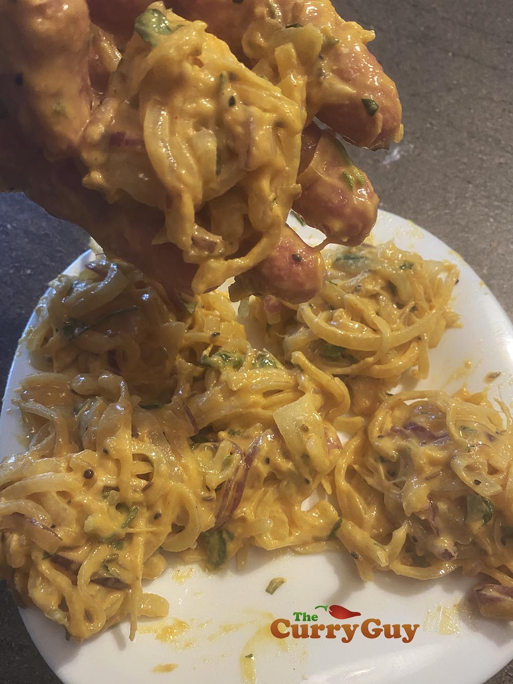 Forming the onion bhajis