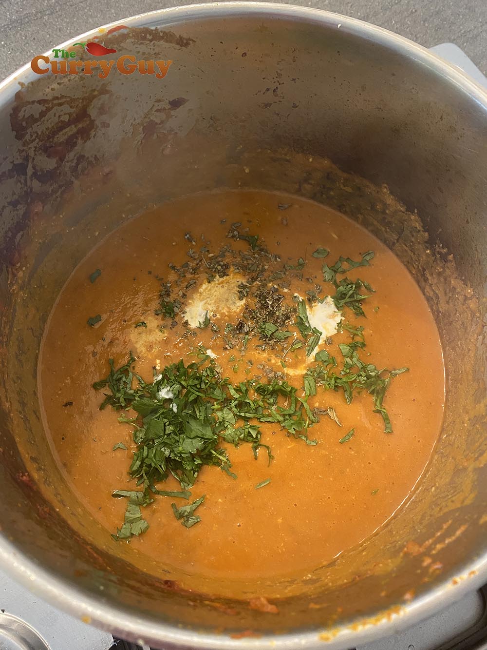 Adding fenugreek, coriander and cream