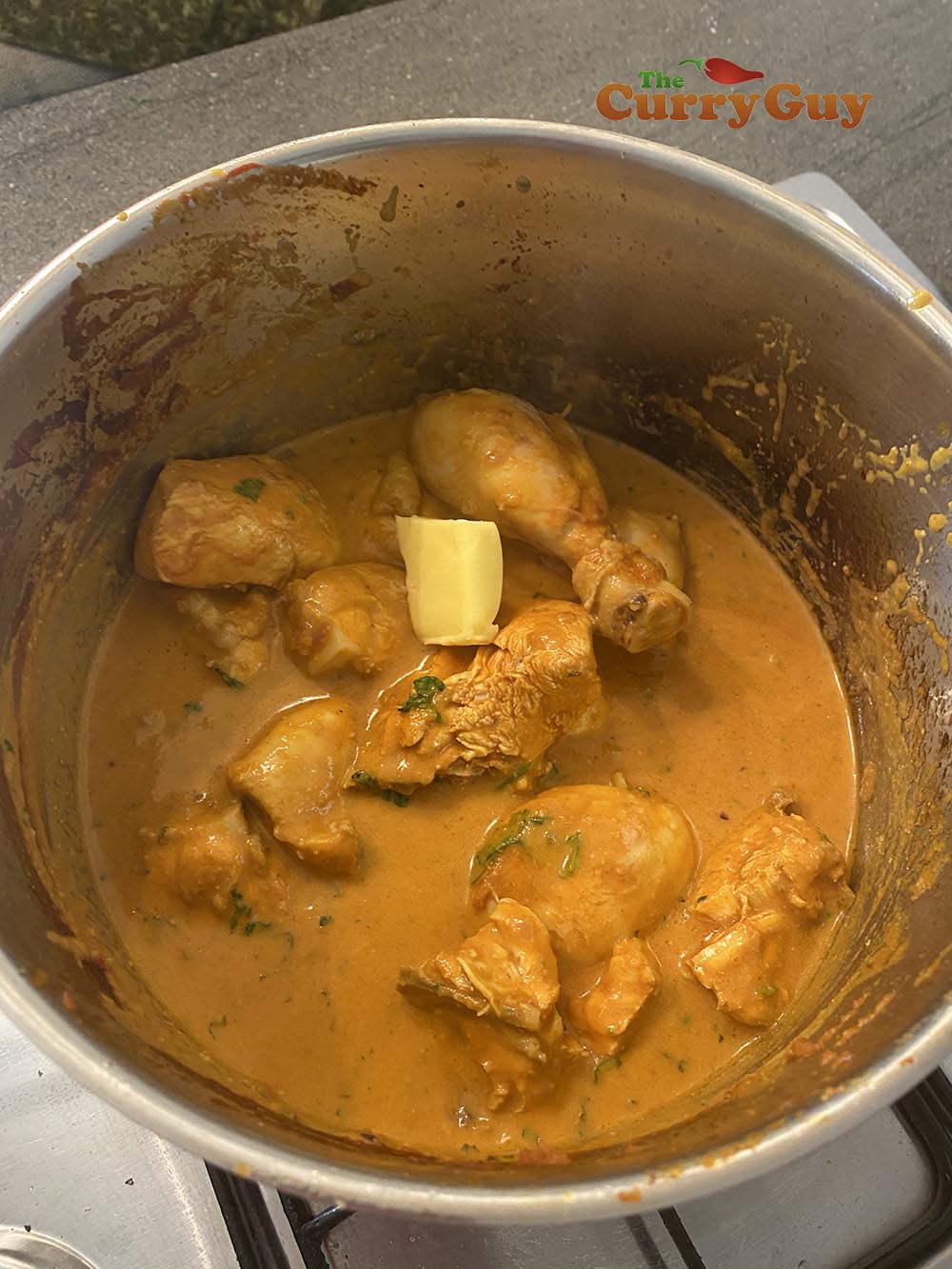 Returning chicken to pan