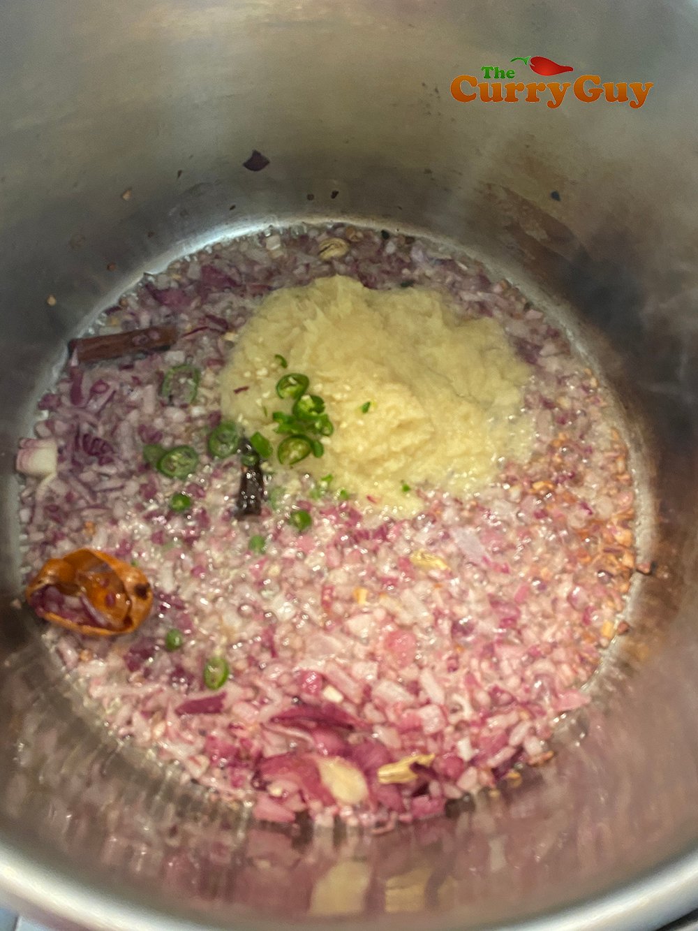 Adding garlic and ginger and chillie