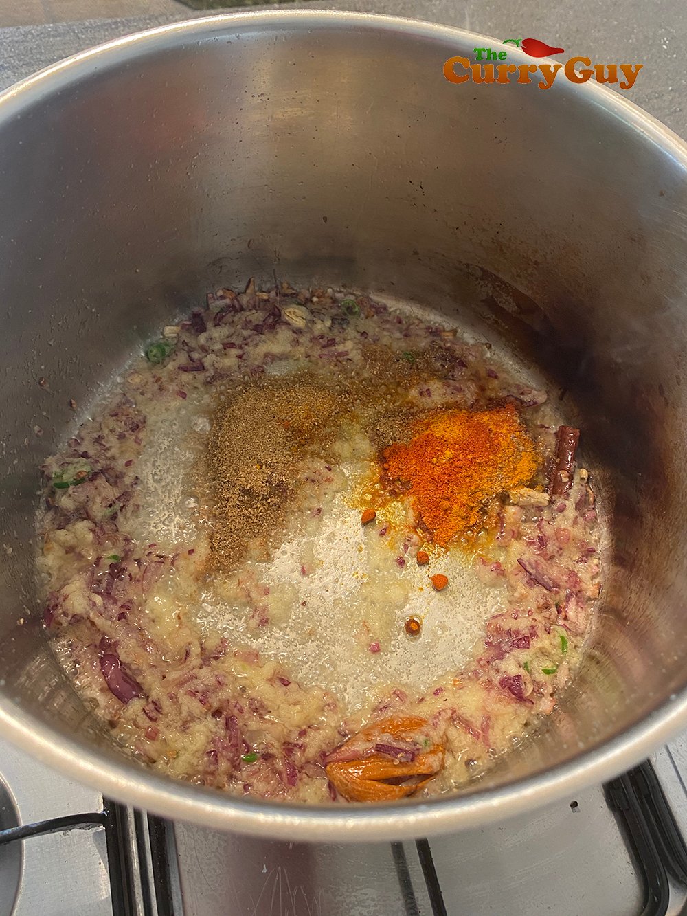 Stirring in ground spices.