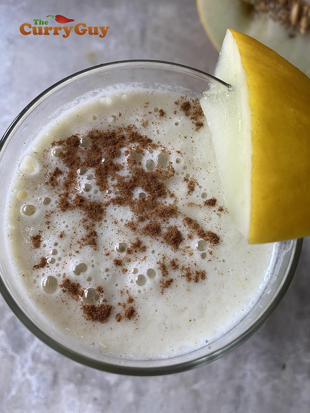 Garnishing the lassi.