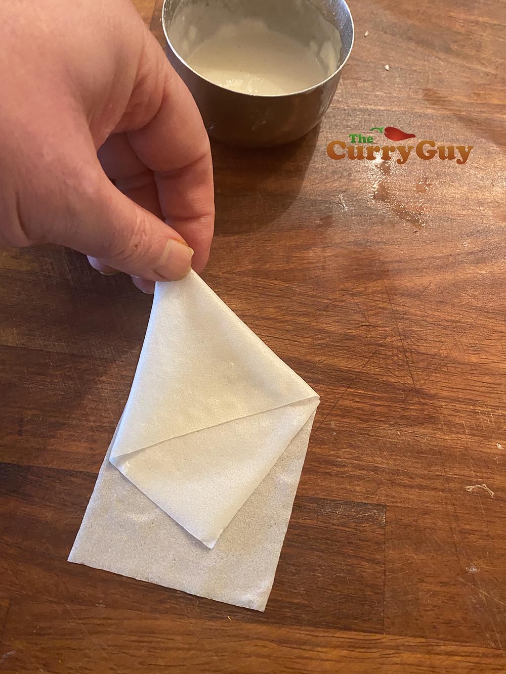 Picking up samosa wrapper