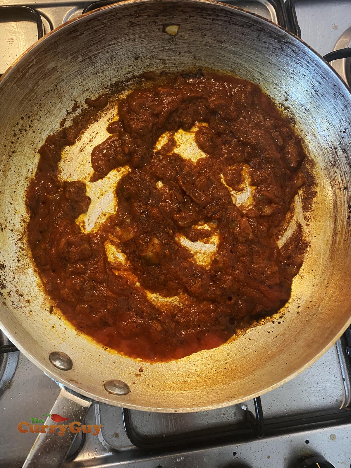 Stirring in tomato puree