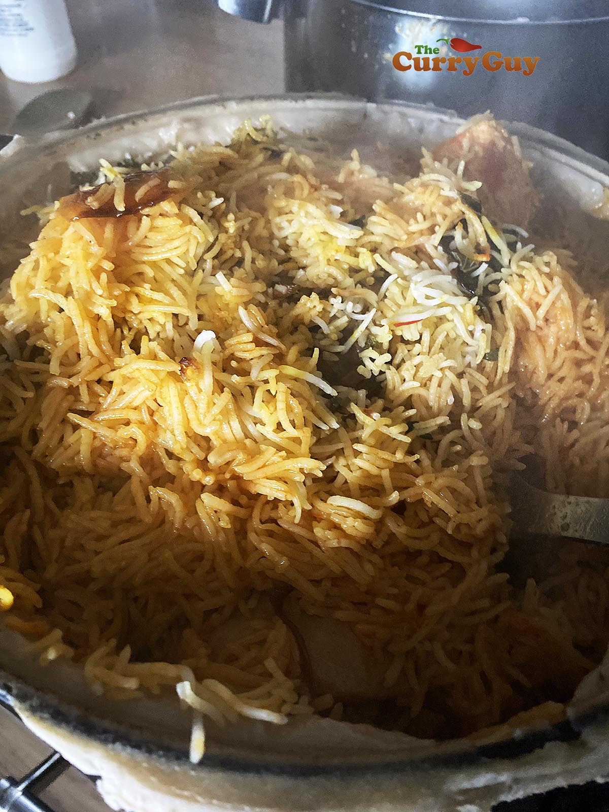Stirring chicken biryani