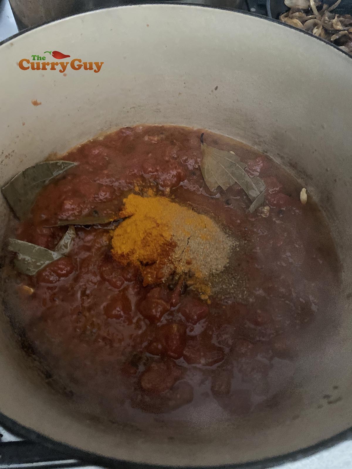 Adding whole spices to the pan