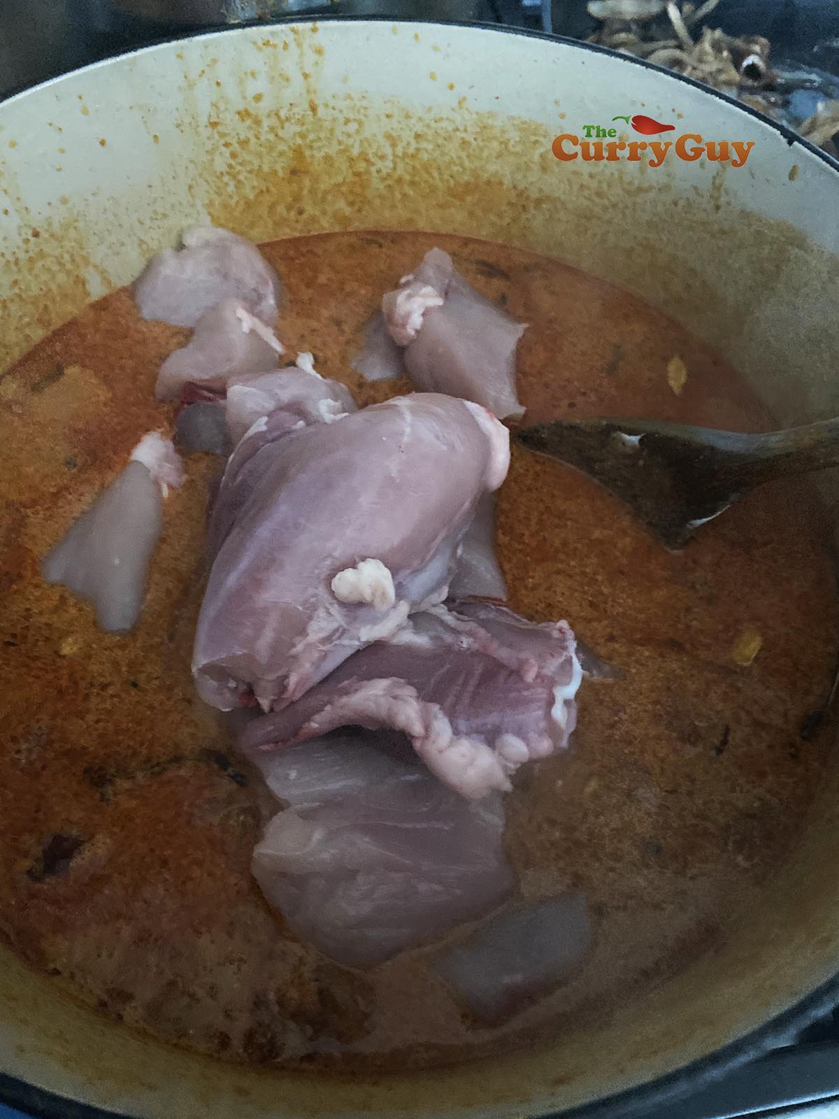 Adding chicken to the pan