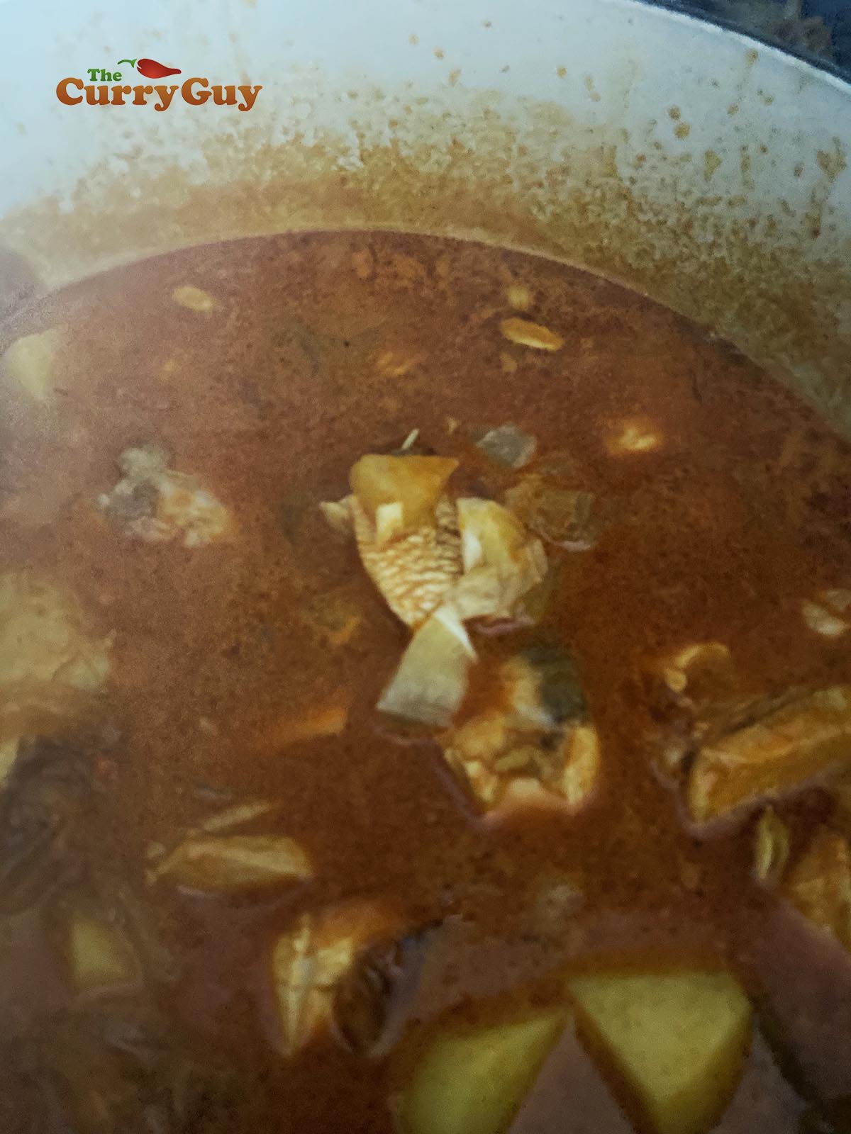 Simmering chicken biryani sauce