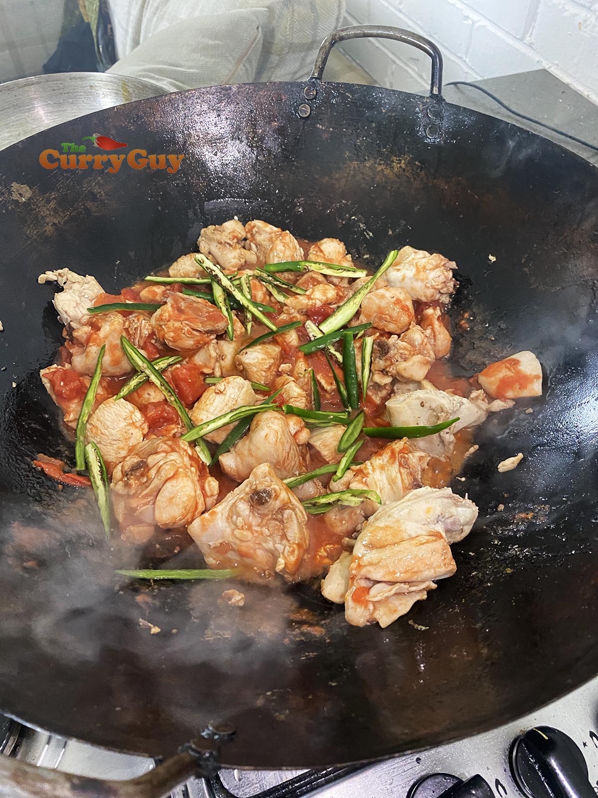 Stirring in the chillies