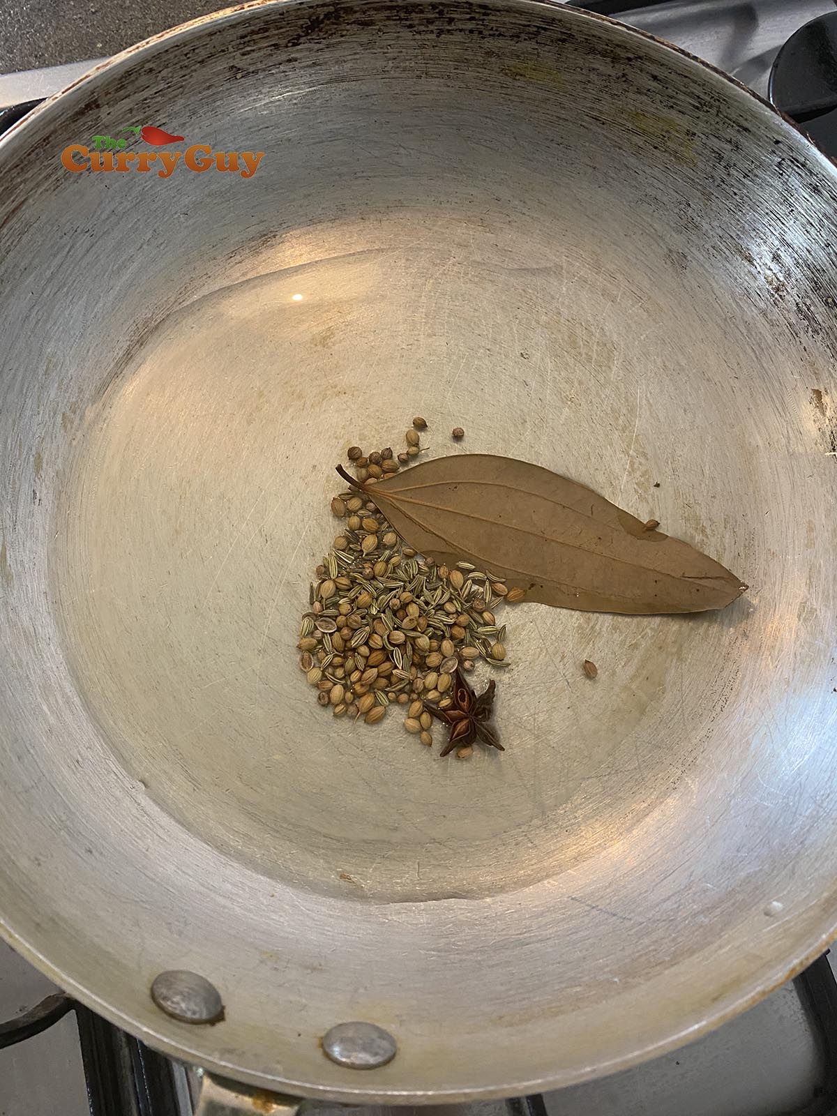 Infusing whole spices in oil. 