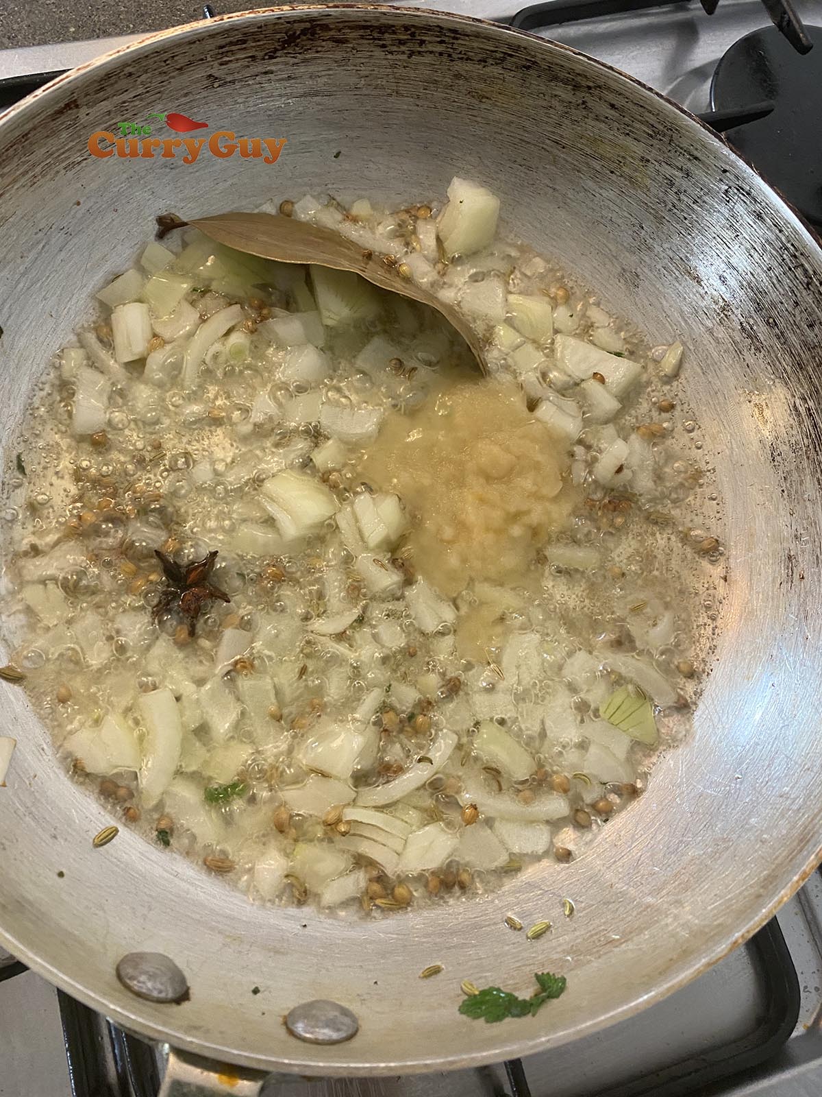 Frying onions and garlic and ginger paste.