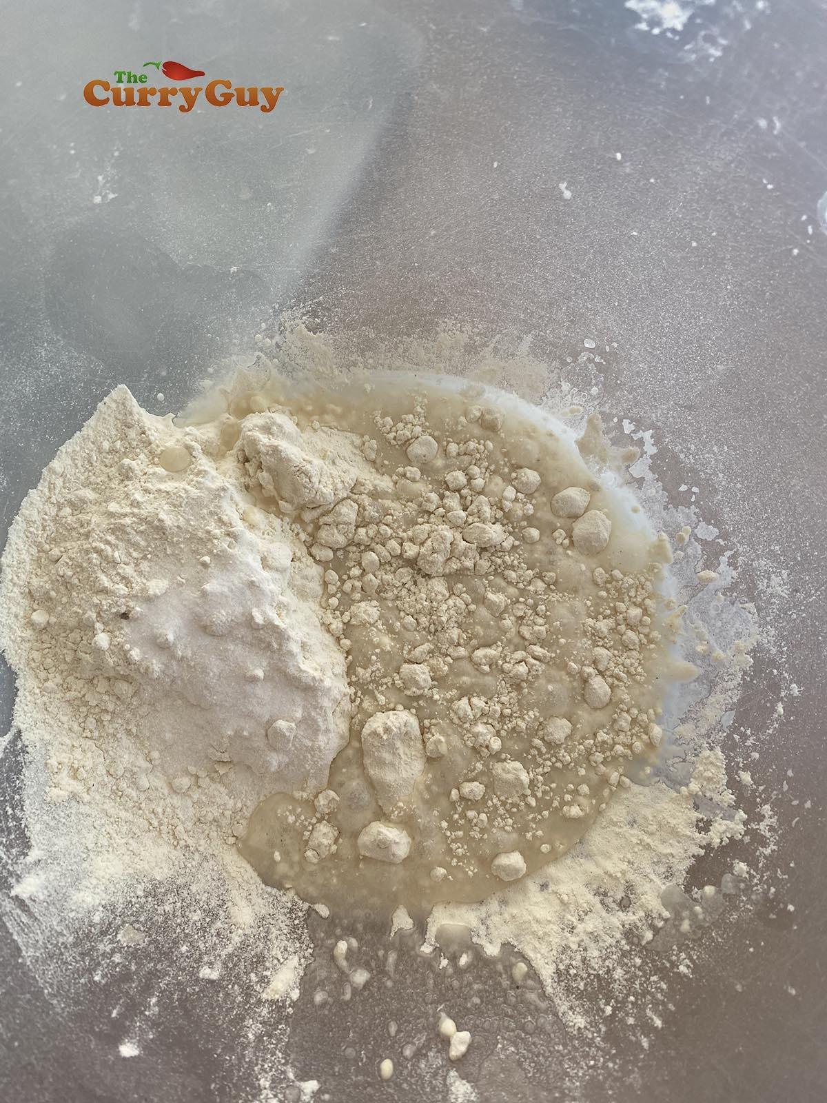 Adding water to dry ingredients for papads