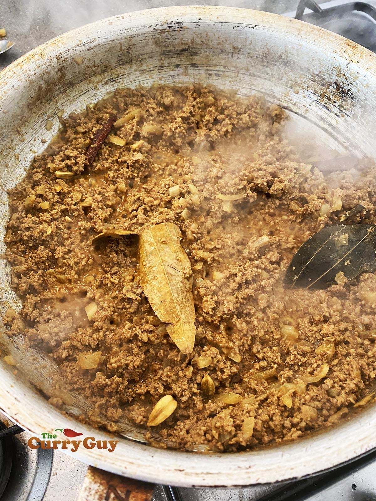 reducing the liquid in the pan.