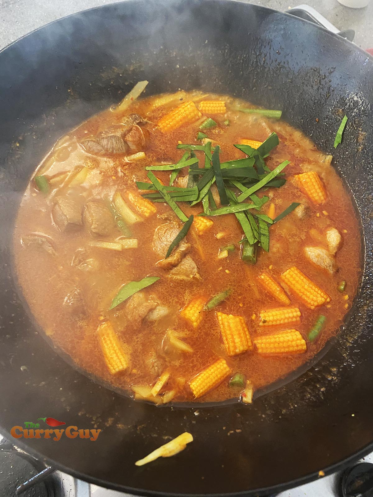 Adding kaffir lime leaves