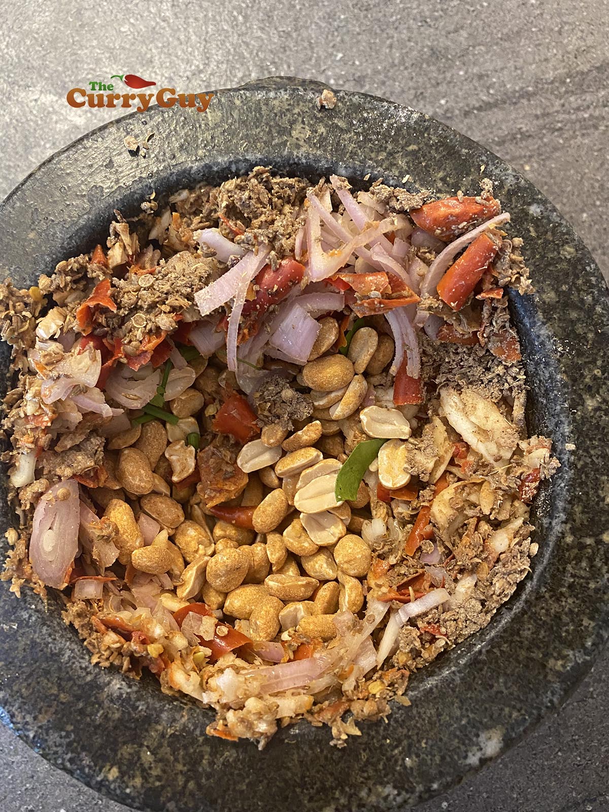 Adding peanuts to paste