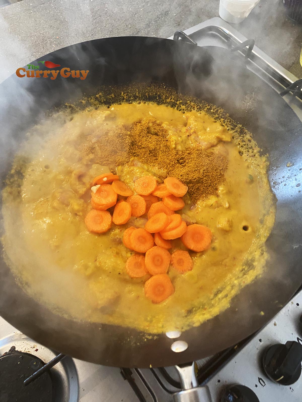 Adding carrots and curry powder