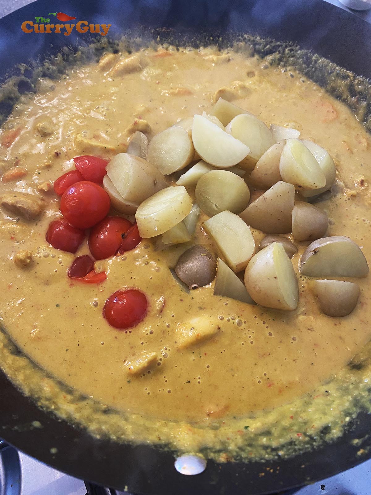 Adding potatoes and tomatoes