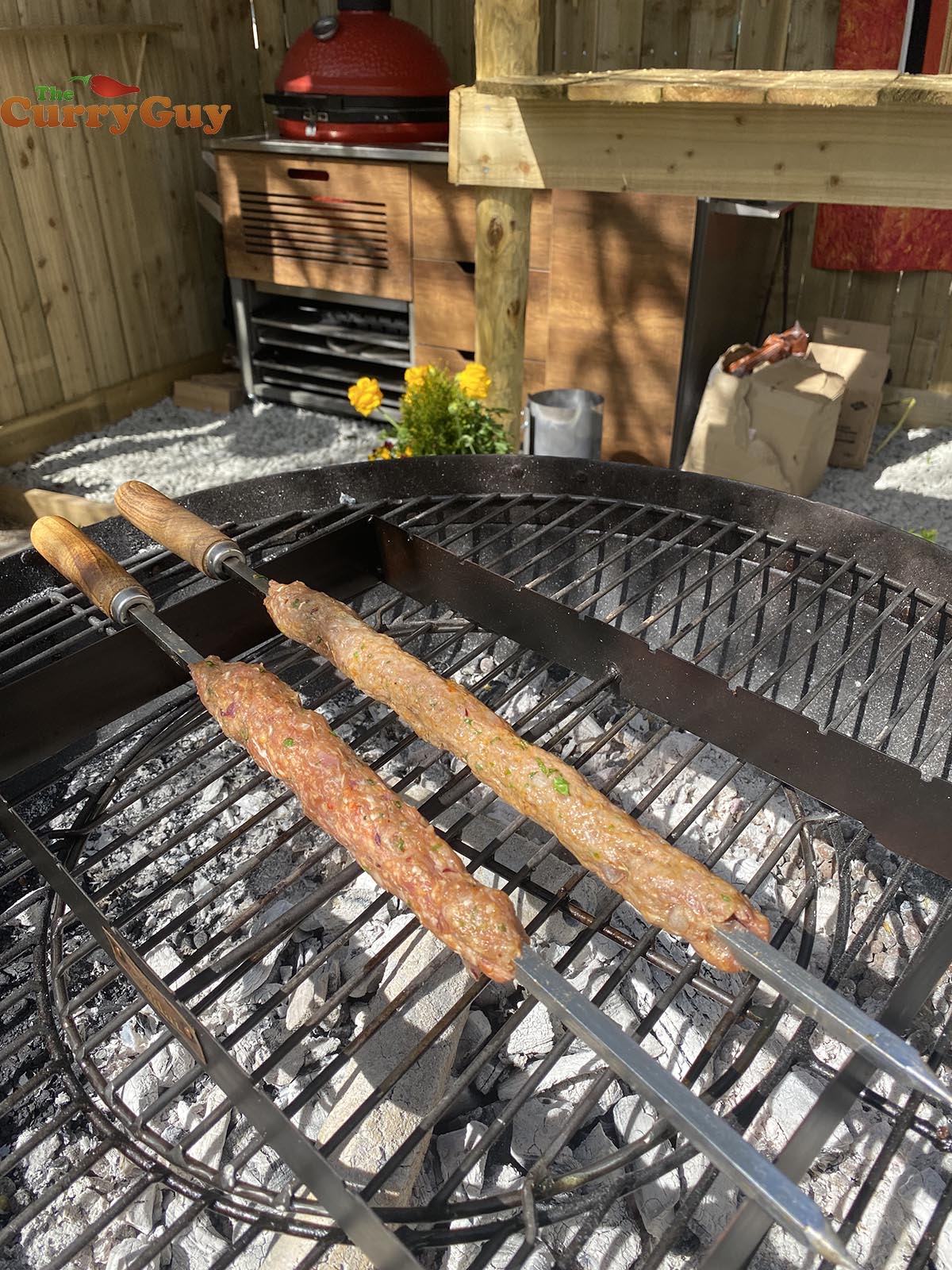 Kebabs cooking over coals.