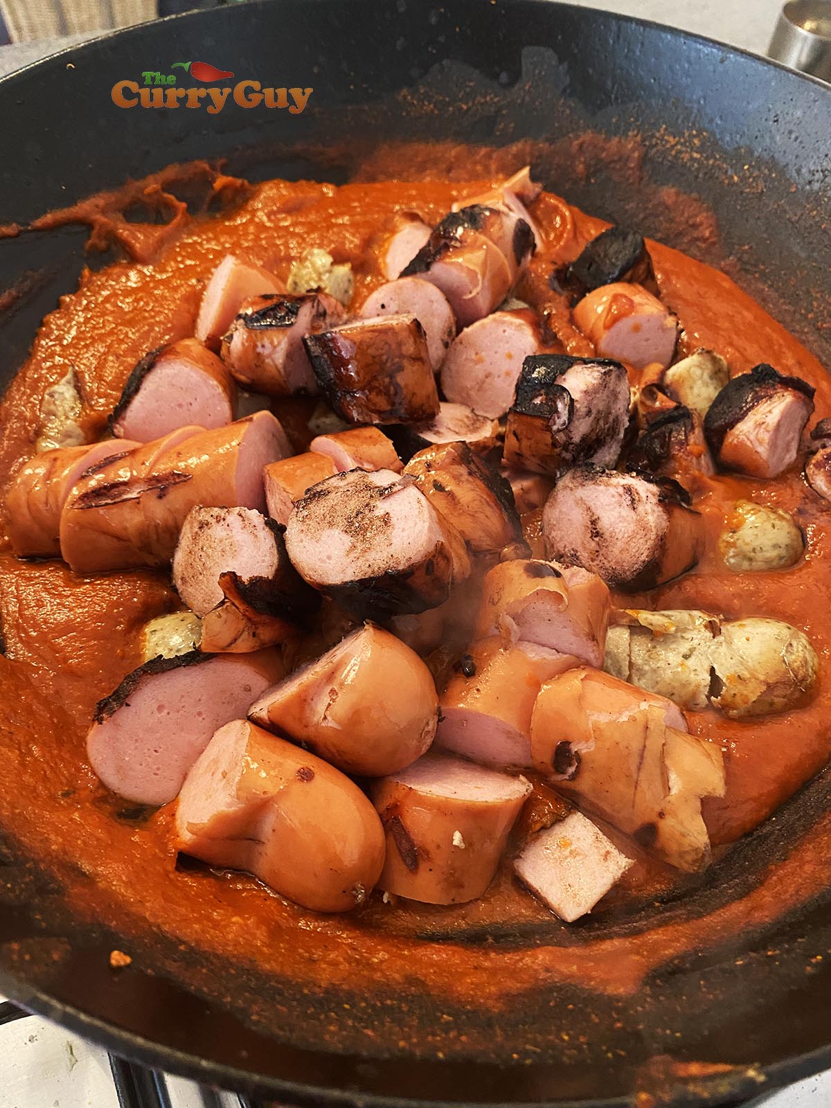 Adding sausage to sauce