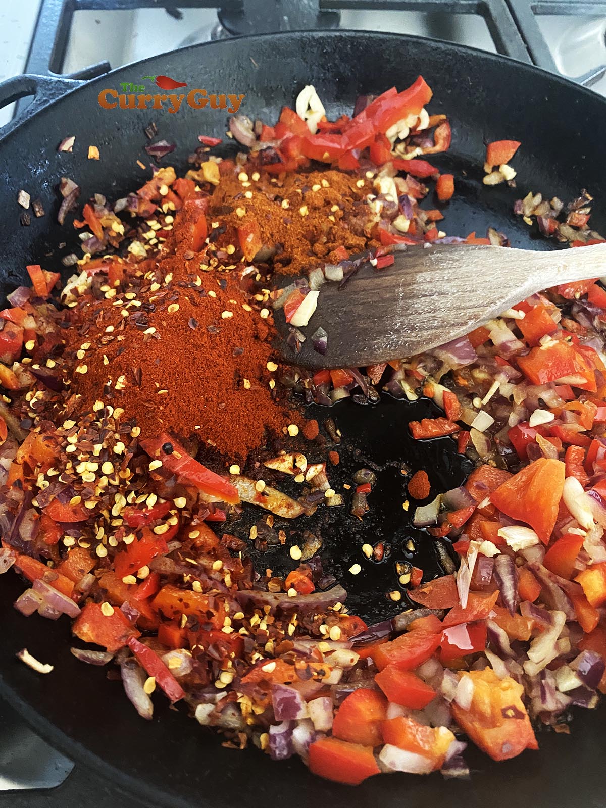 Adding ground spices to pan