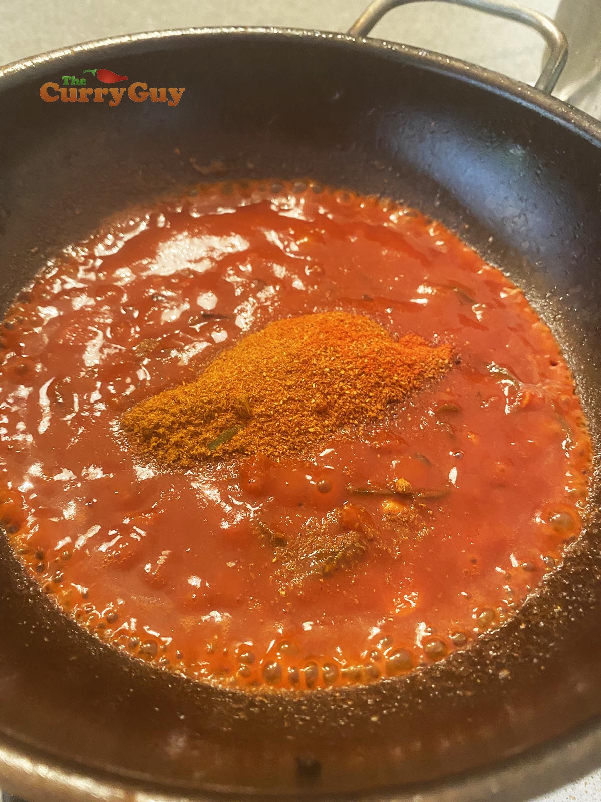 Stirring ground spices into the mix