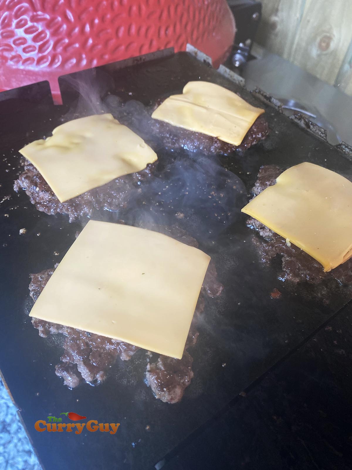 Cheese on top of burger patties