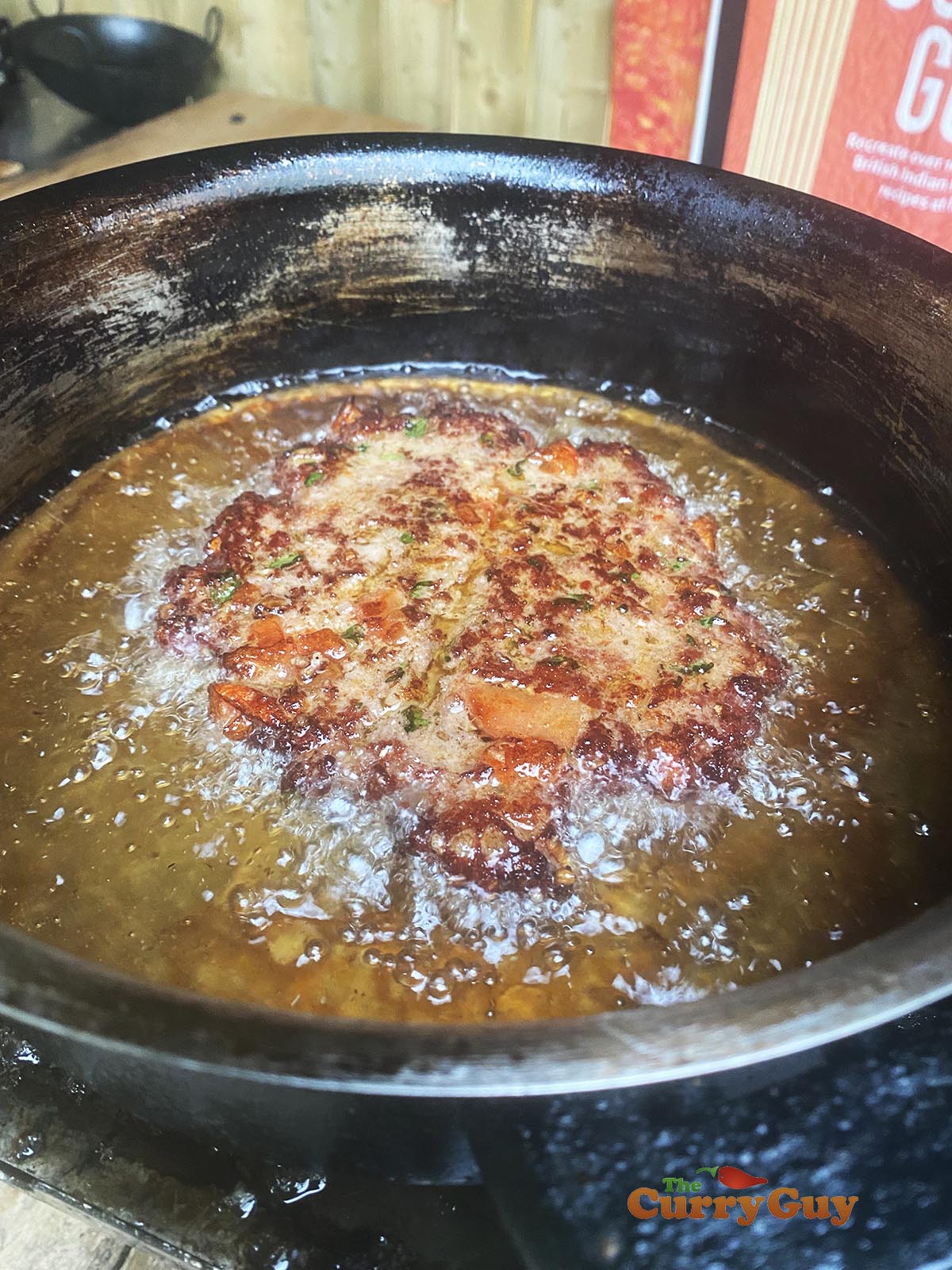 Frying a beef chapli kebab