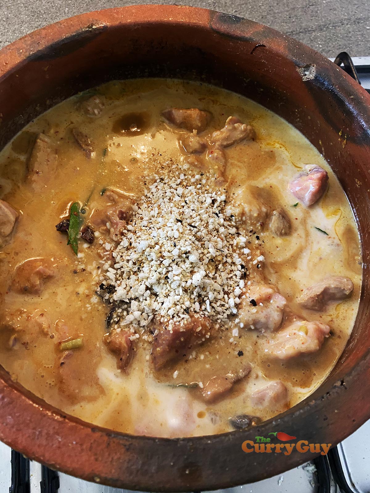 Adding toasted coconut to pan