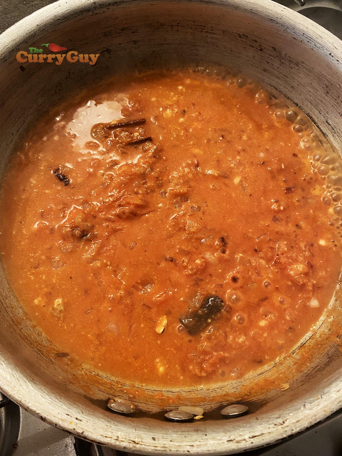 Adding chicken stock to sauce