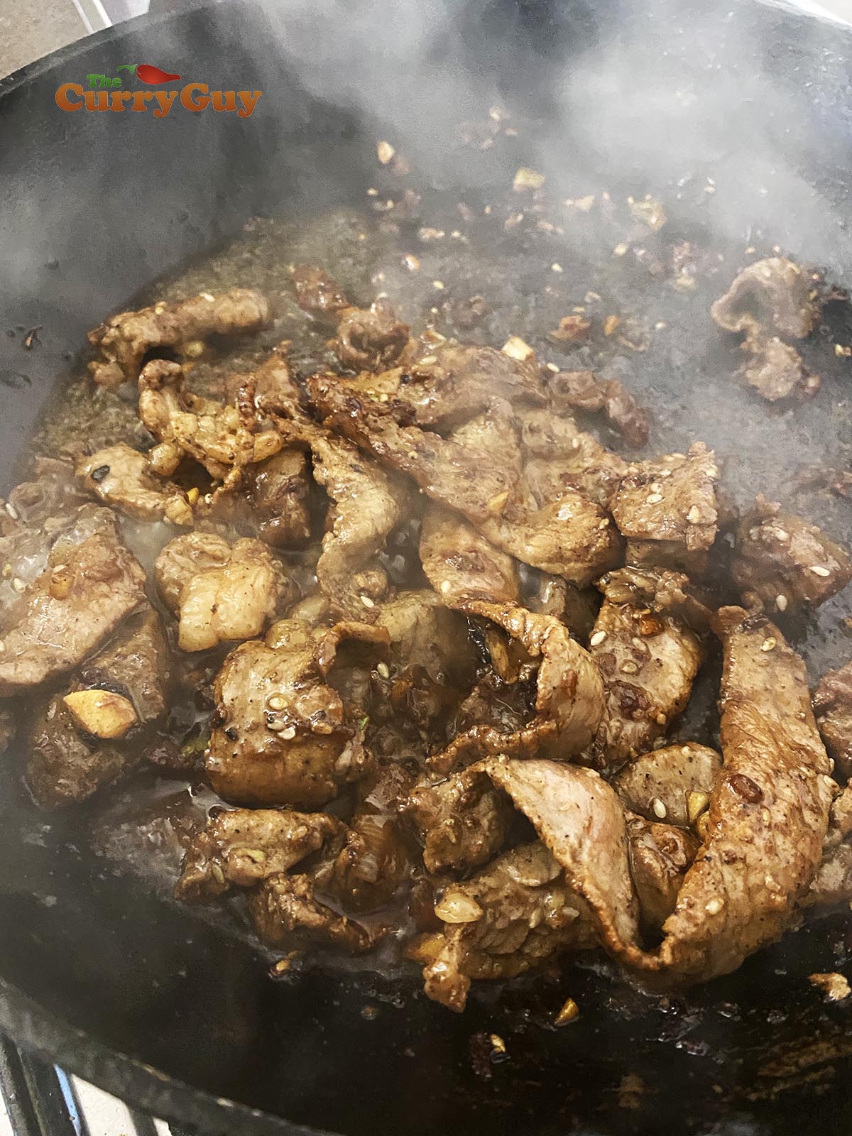 frying a large batch of beef strips for bulgogi