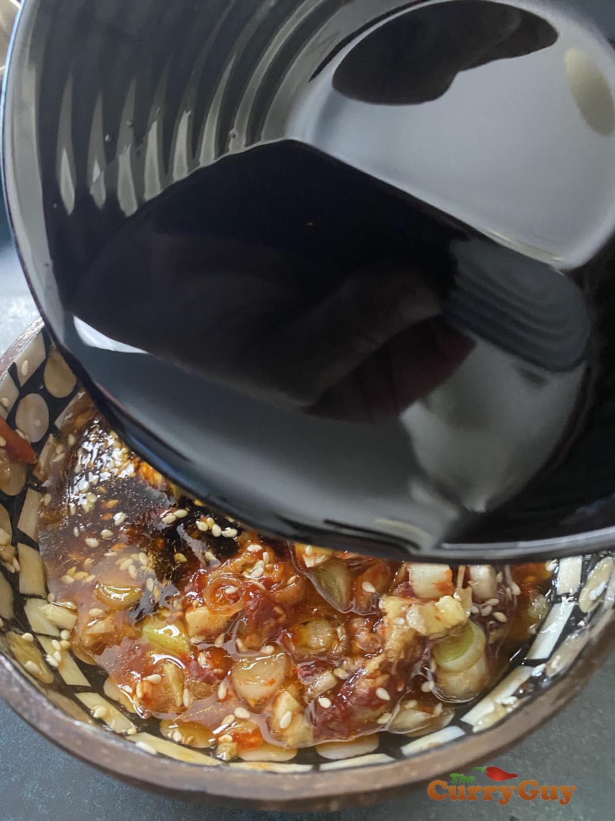 Adding liquid ingredients to the mixing bowl