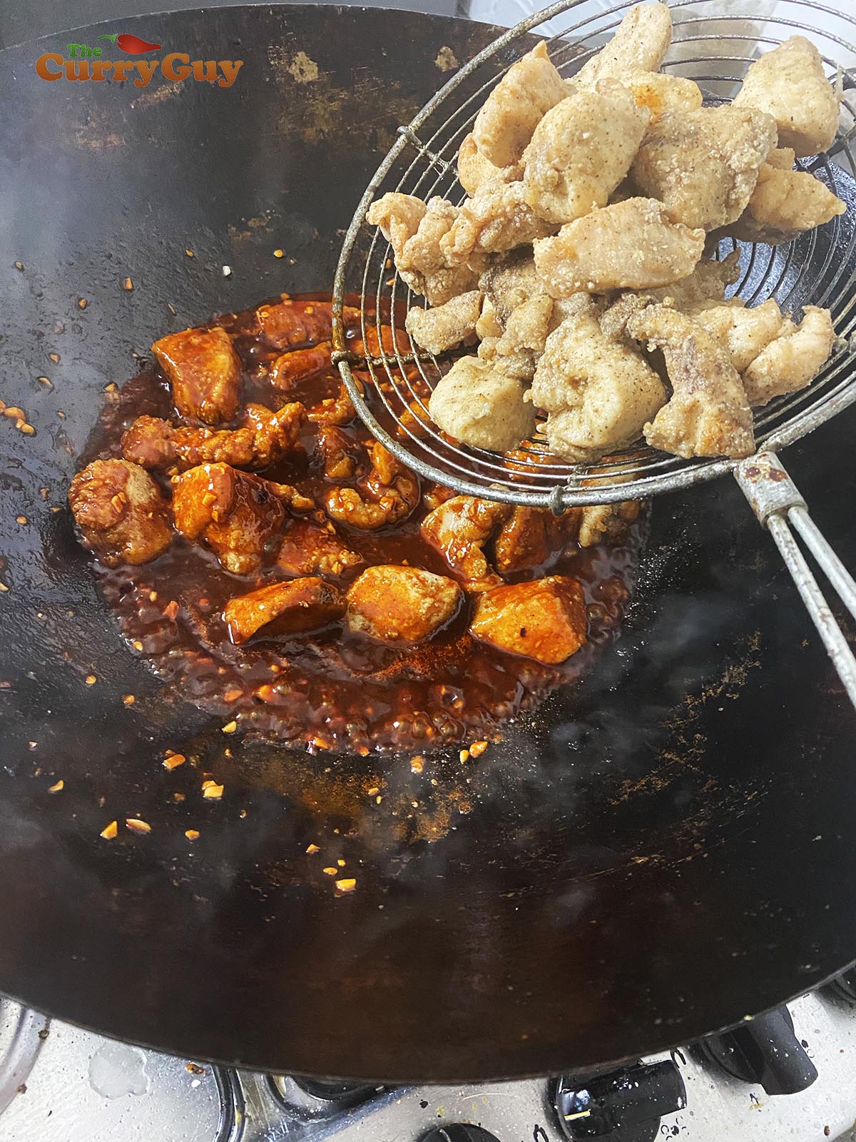 Adding fried chicken to Korean sweet and sour sauce