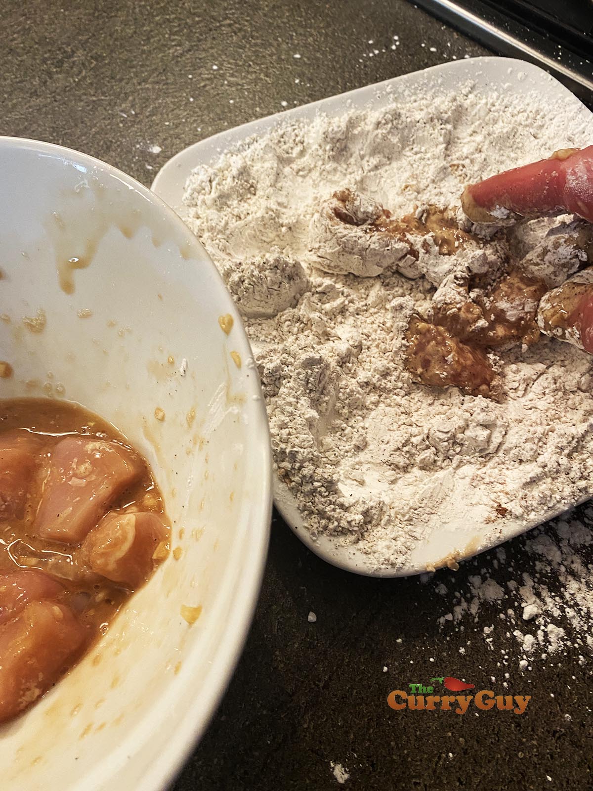 Dusting chicken with flour mixture