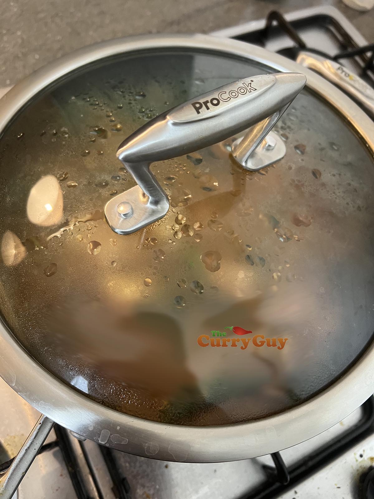 Covering the pan to simmer