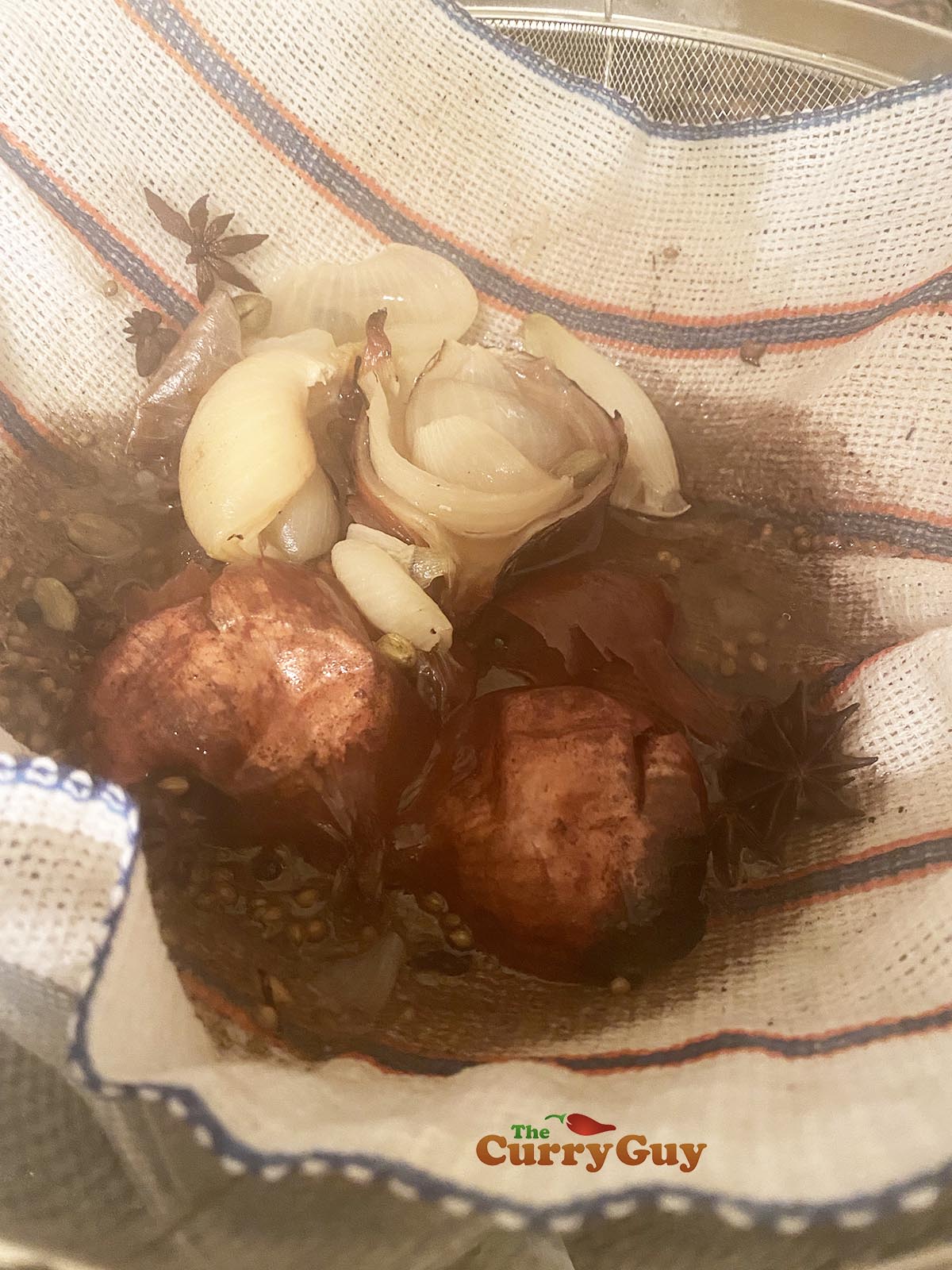 Straining the beef pho broth