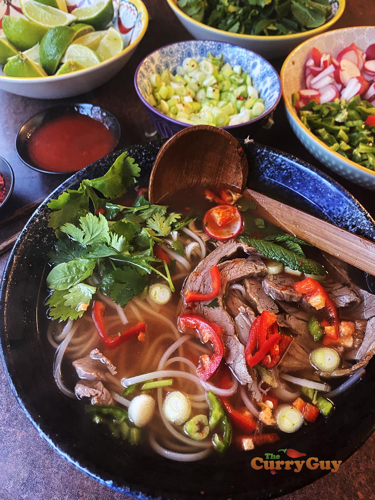 beef pho in a serving bowl.