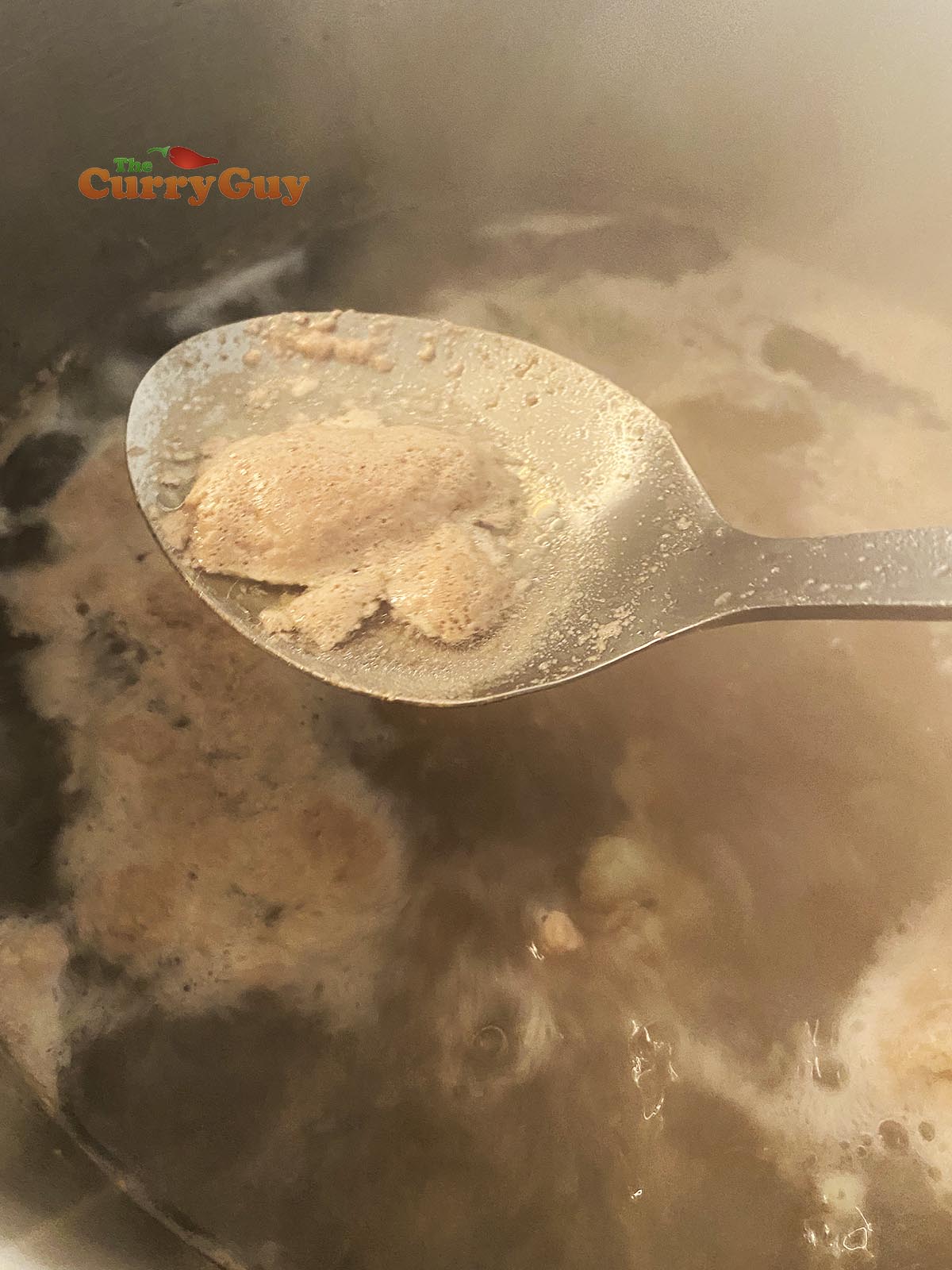 simming the top of the broth