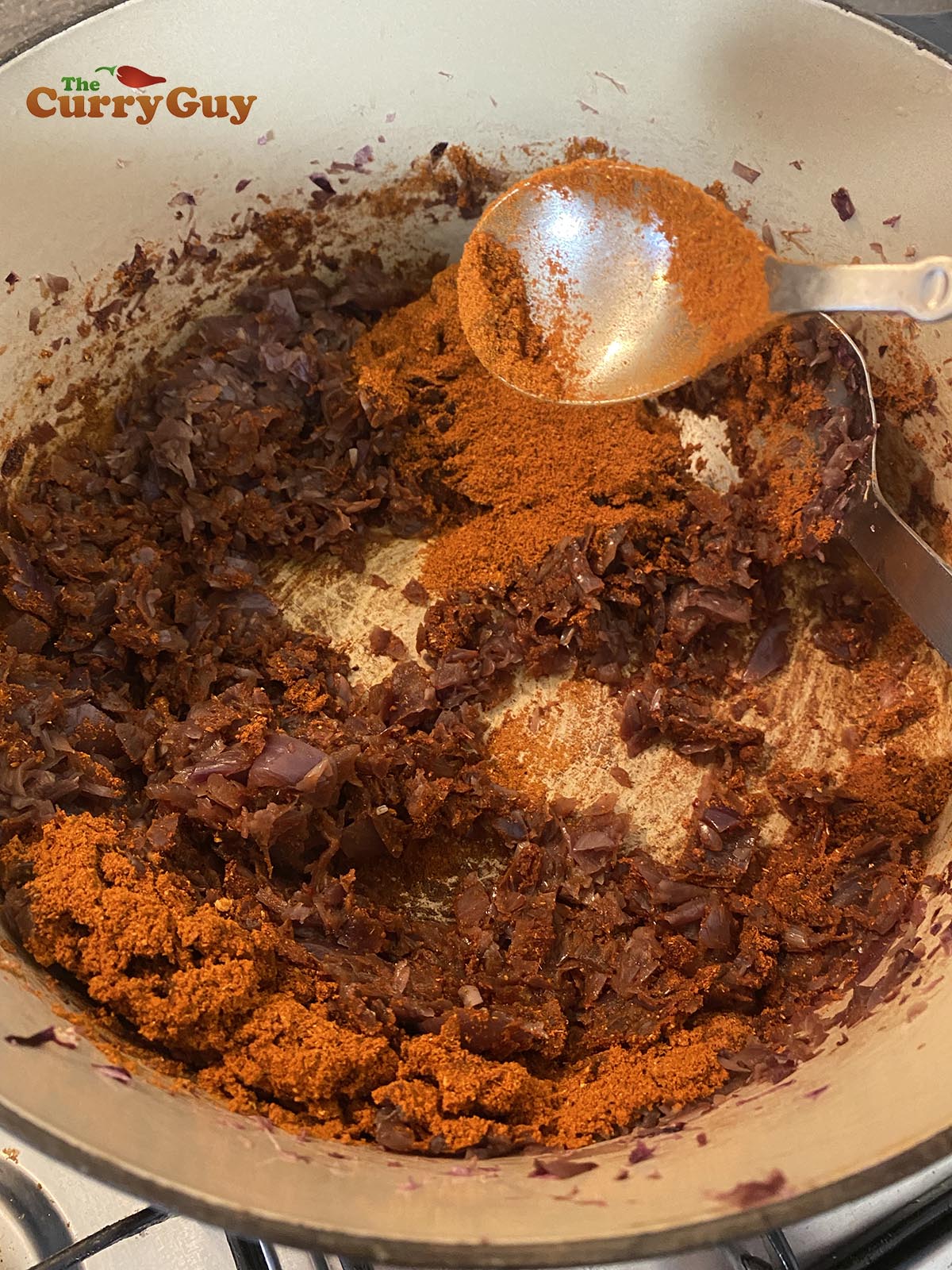 Adding spices to onions