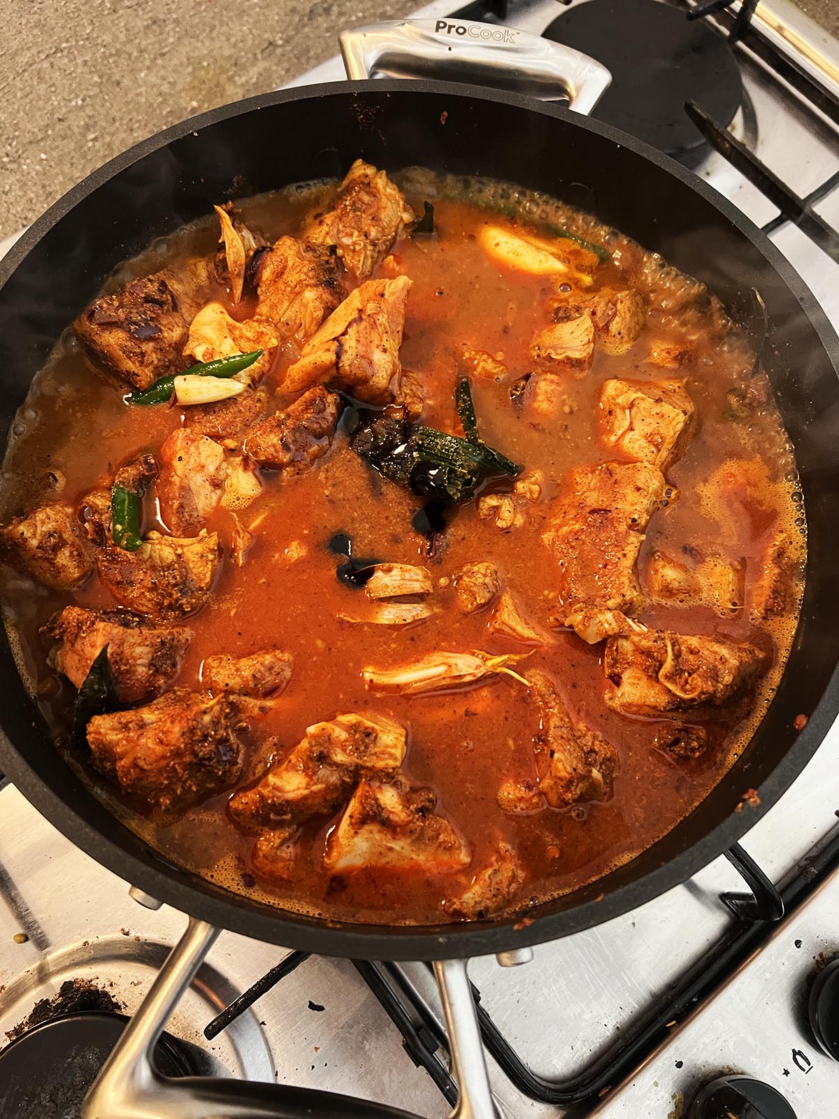 Adding water and remaining ingredients to pan.
