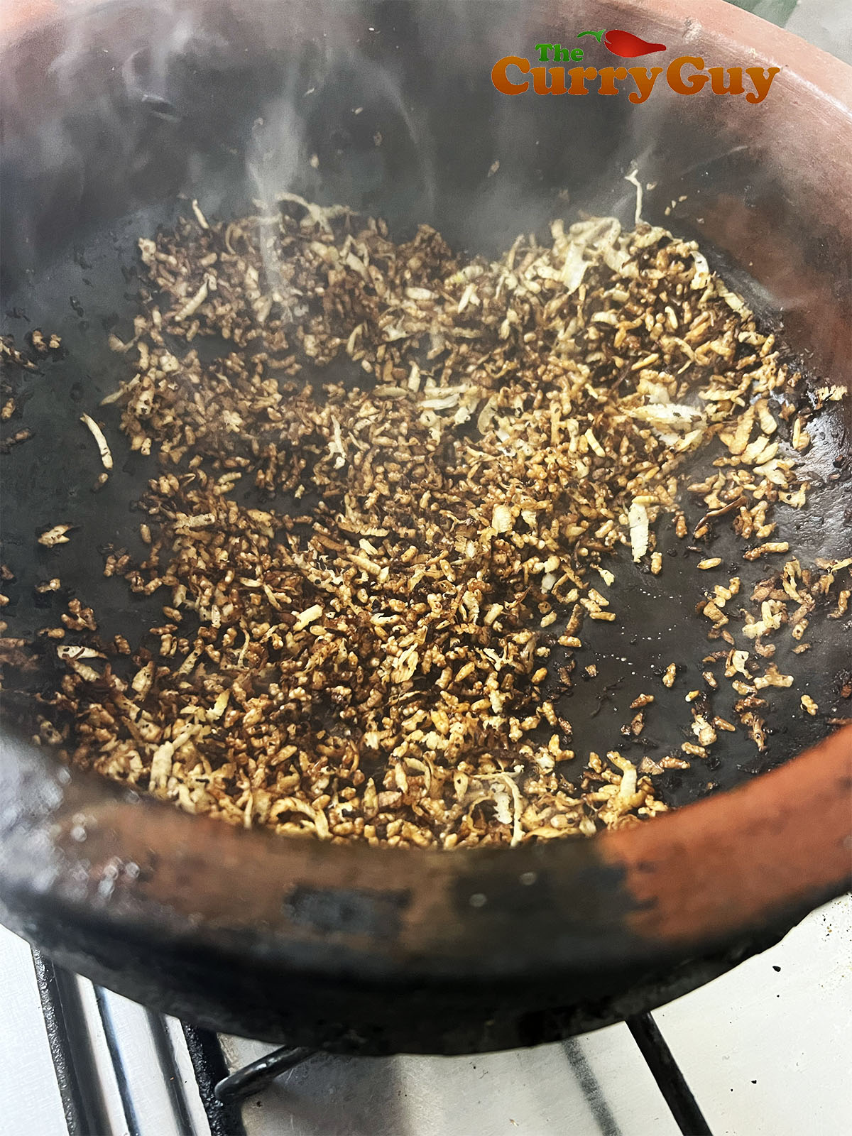 The finished dry fried rice and coconut.
