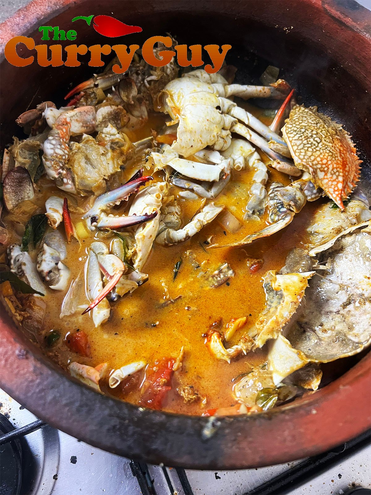 Bringing the crabs in the sauce to a boil.