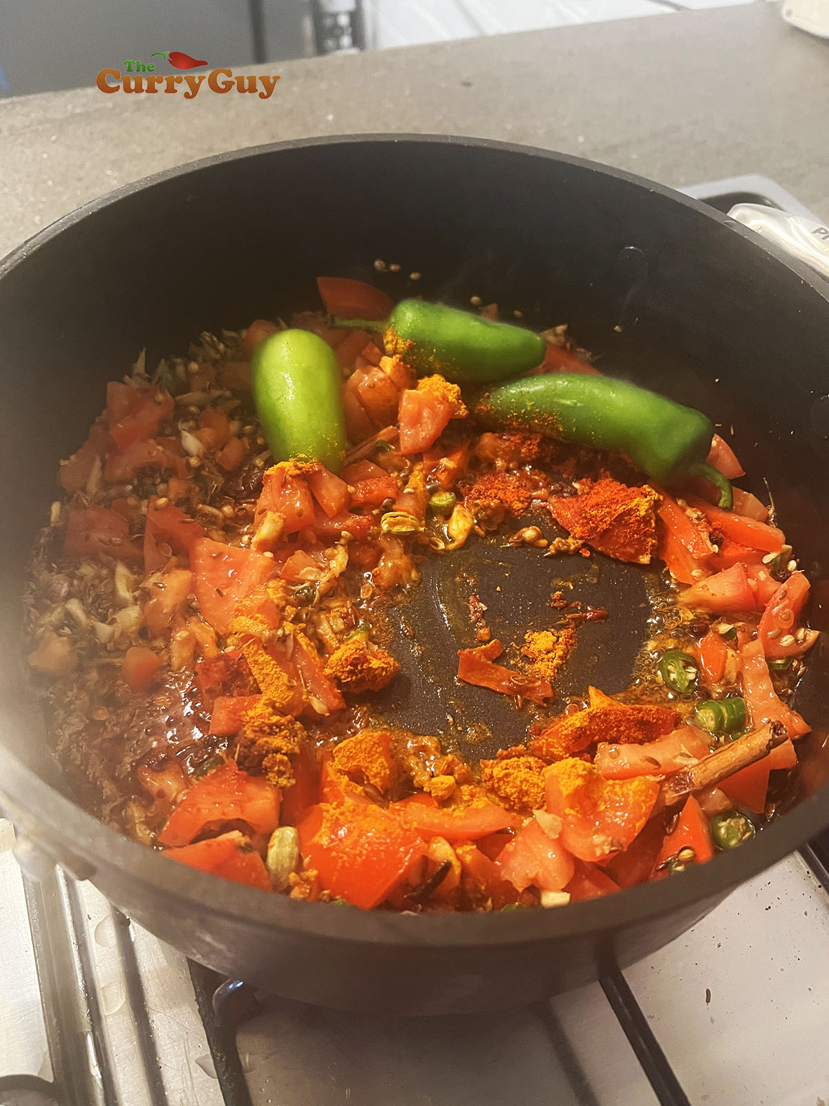 Adding ground spices to pan