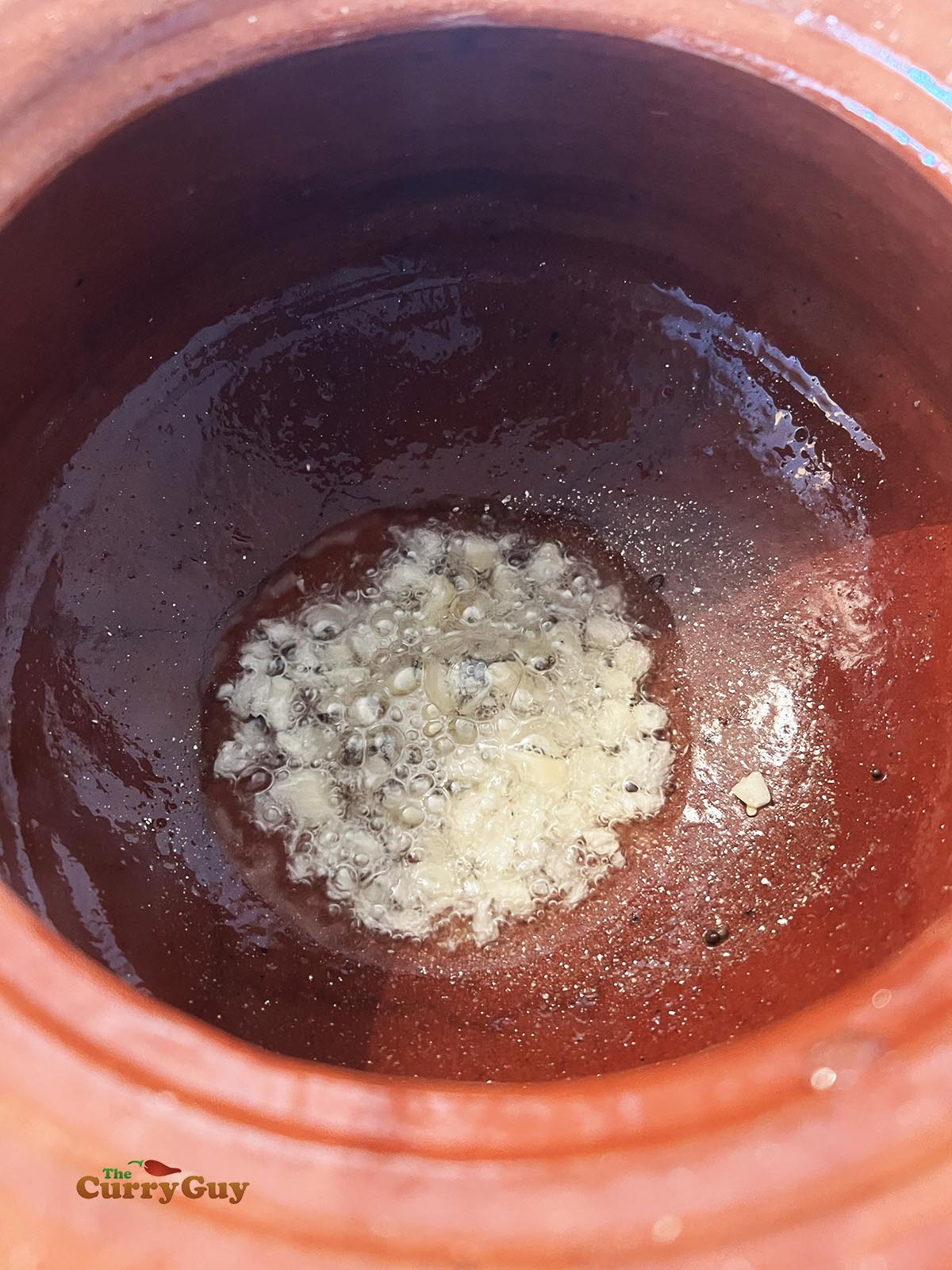 frying mustard seeds and garlic