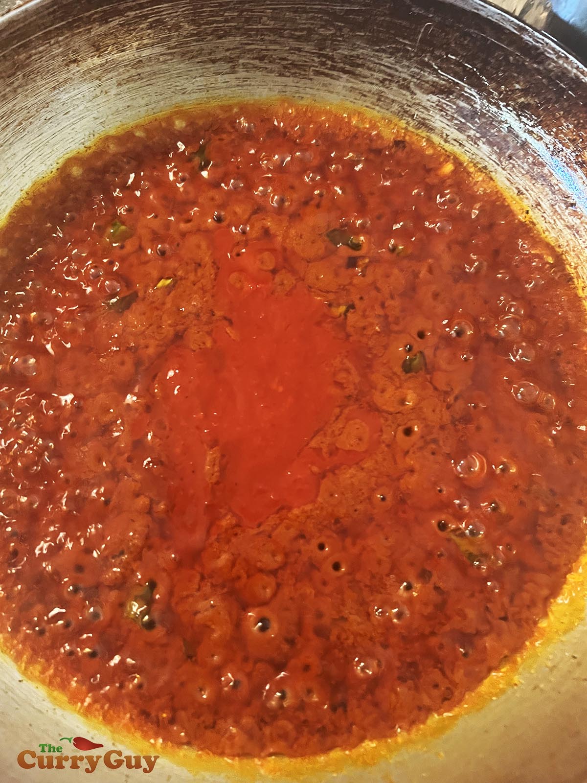 Adding hot sauce to pan