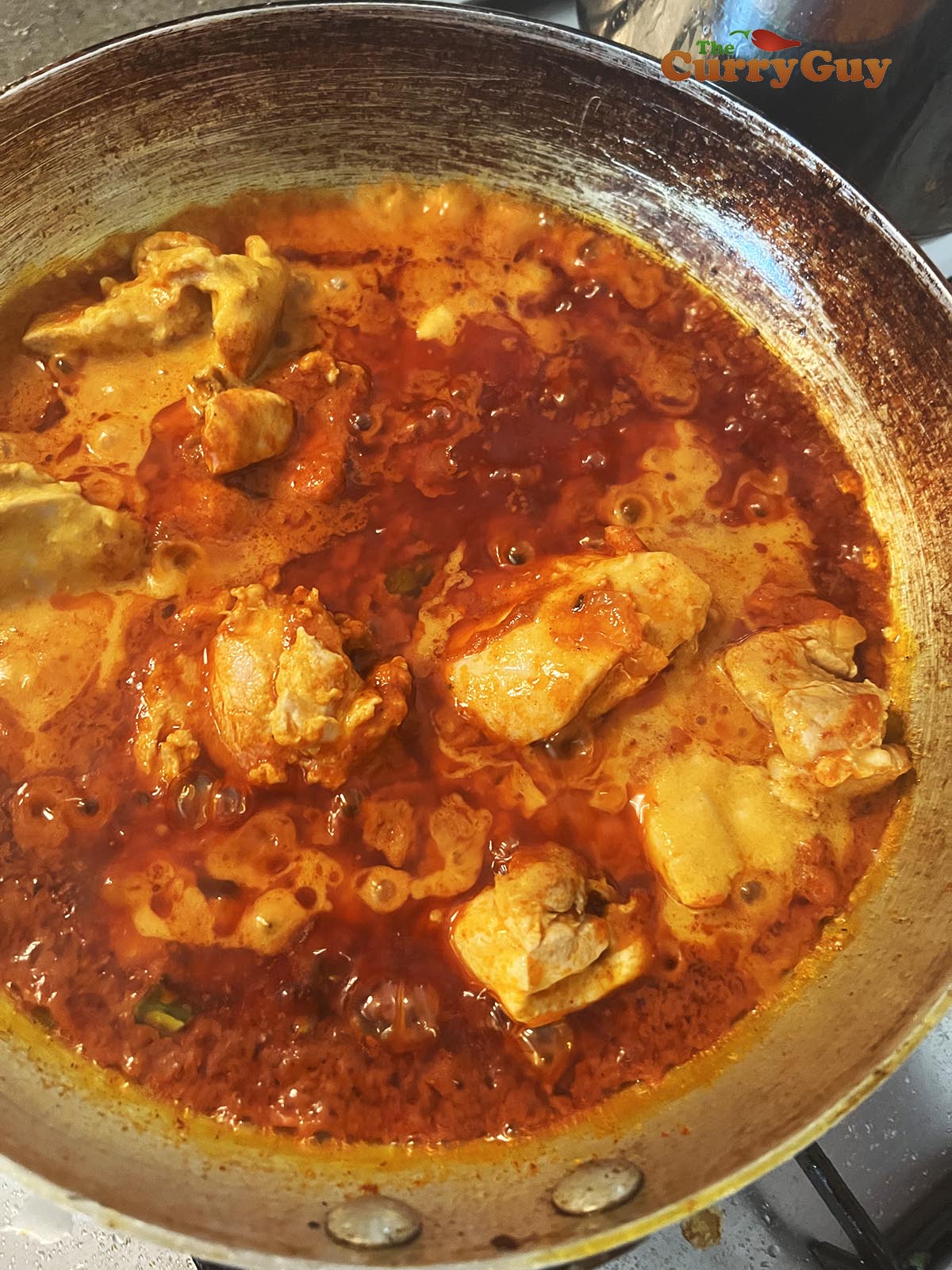 Adding cooked chicken to pan