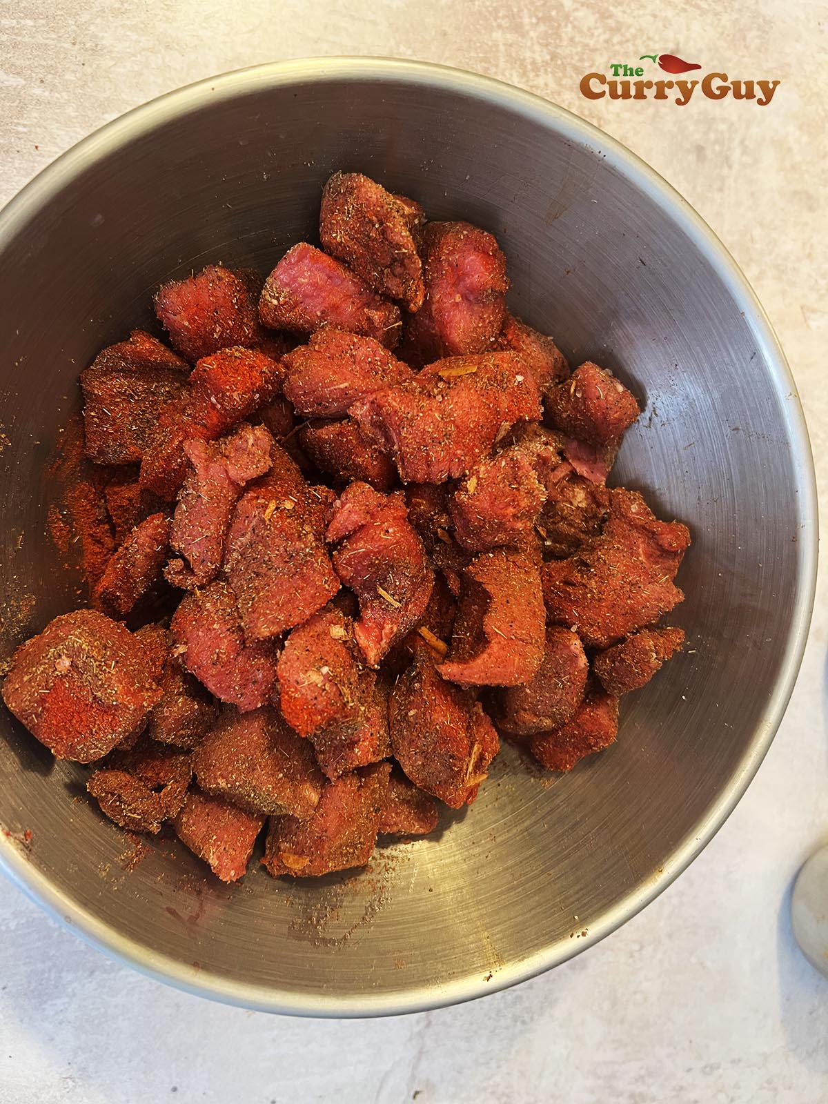 Beef covered in spices.