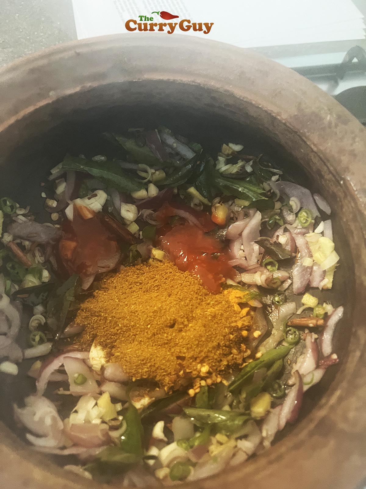 Adding fresh ingredients to pot