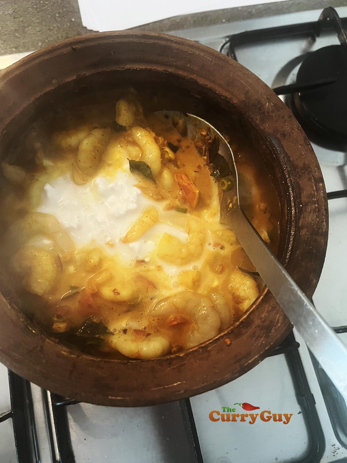 Adding coconut milk.